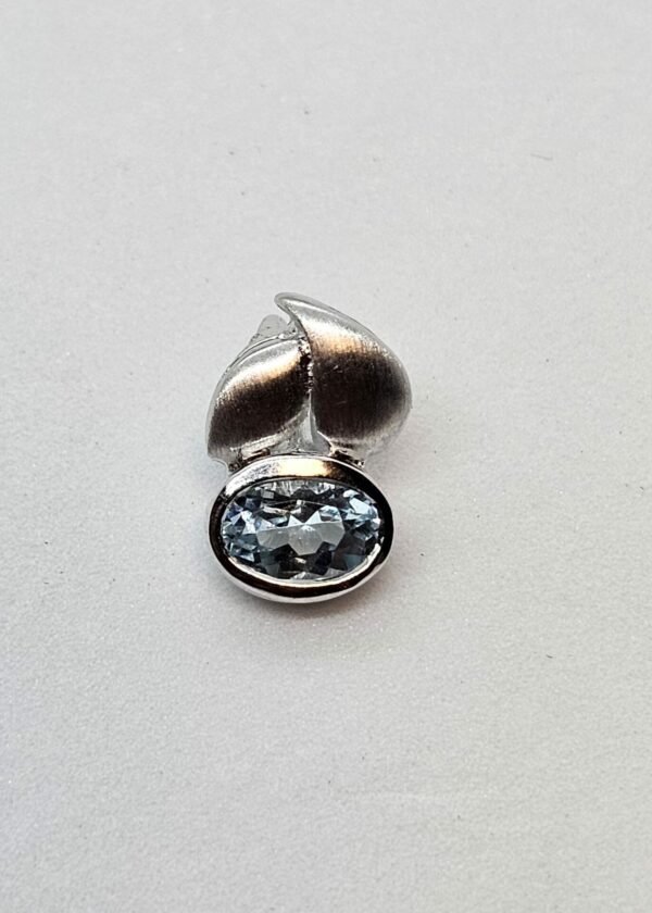 Silver pendant with pale blue stone